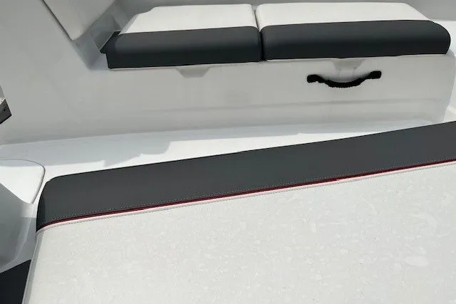 Slide: The Image of 2026 Tahoe T21 boat interior with sleek black and white seating. - 106