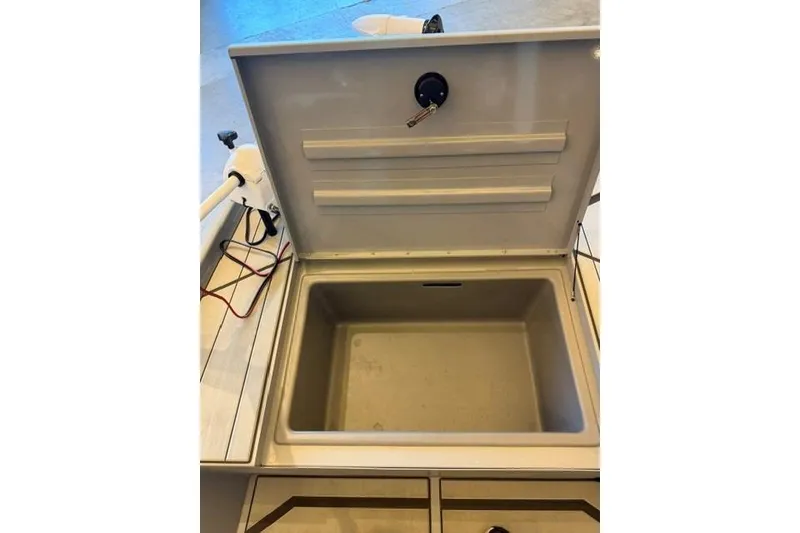 Slide: The Image of Open storage compartment on 2026 Tracker Bass Tracker Classic CC boat. - 10