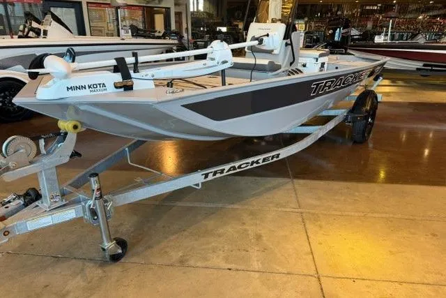 Slide: The Image of 2026 Tracker Bass Tracker Classic CC boat on display with Minn Kota trolling motor. - 3