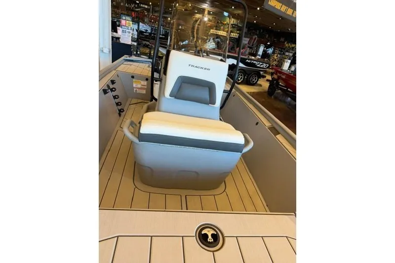 Slide: The Image of 2026 Tracker Bass Tracker Classic CC boat interior with seating and steering console. - 7