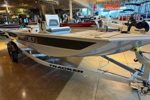 Slide: The Image of 2026 Tracker Bass Tracker Classic CC boat displayed indoors on a trailer. - 4