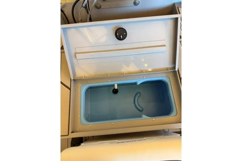 Slide: The Image of Open storage compartment in 2026 Tracker Bass Tracker Classic CC boat. - 11