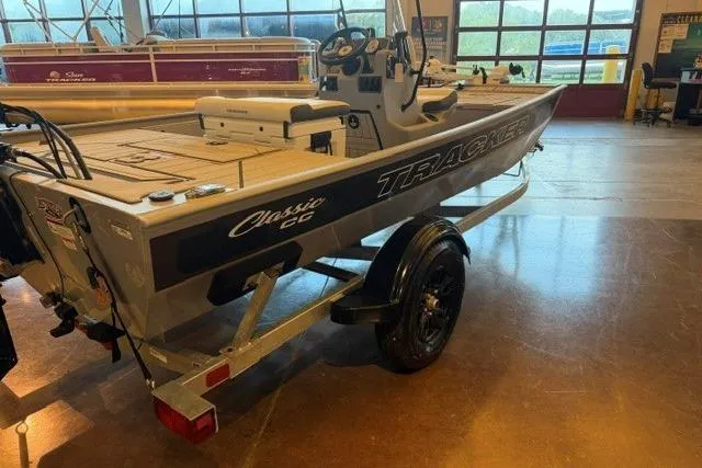 The Image of 2026 Tracker Bass Tracker Classic CC boat in showroom, side view with trailer. - 0