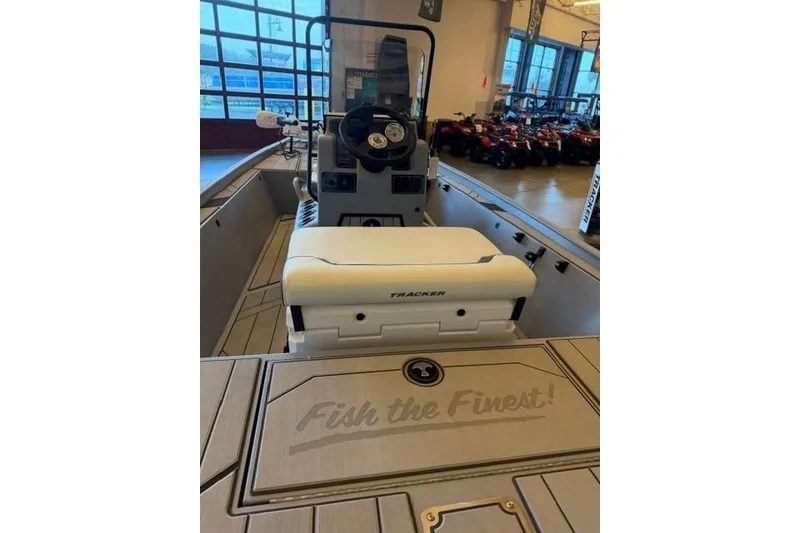 Slide: The Image of 2026 Tracker Bass Tracker Classic CC boat interior with steering console and seating. - 5