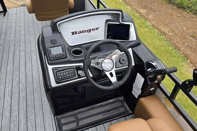 Slide: The Image of 2026 Ranger 220F boat dashboard with steering wheel and control panel. - 11
