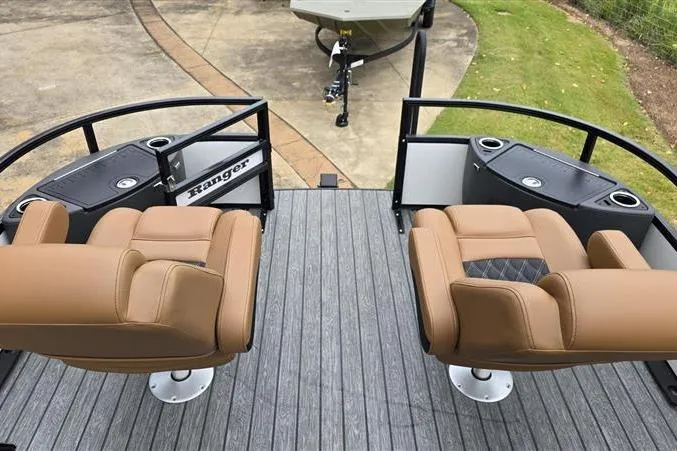 Slide: The Image of 2026 Ranger 220F boat interior with tan seats and sleek design. - 10