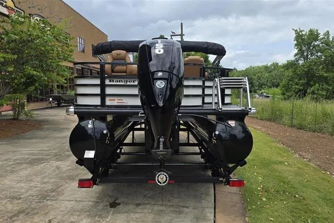 Slide: The Image of 2026 Ranger 220F pontoon boat with powerful outboard motor, parked on a trailer. - 8
