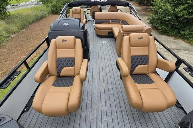 Slide: The Image of Luxurious 2026 Ranger 220F boat interior with tan leather seating and sleek design. - 15