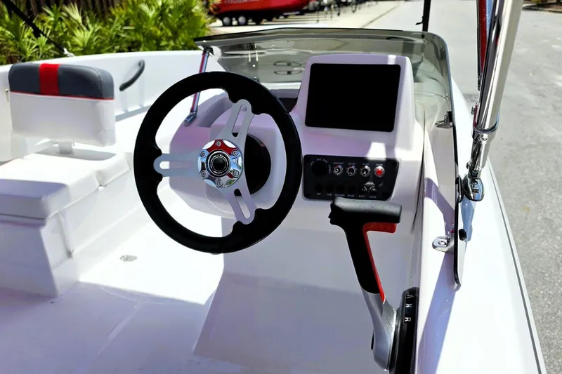 Slide: The Image of 2026 Tahoe T16 boat cockpit with steering wheel, control panel, and seating. - 10