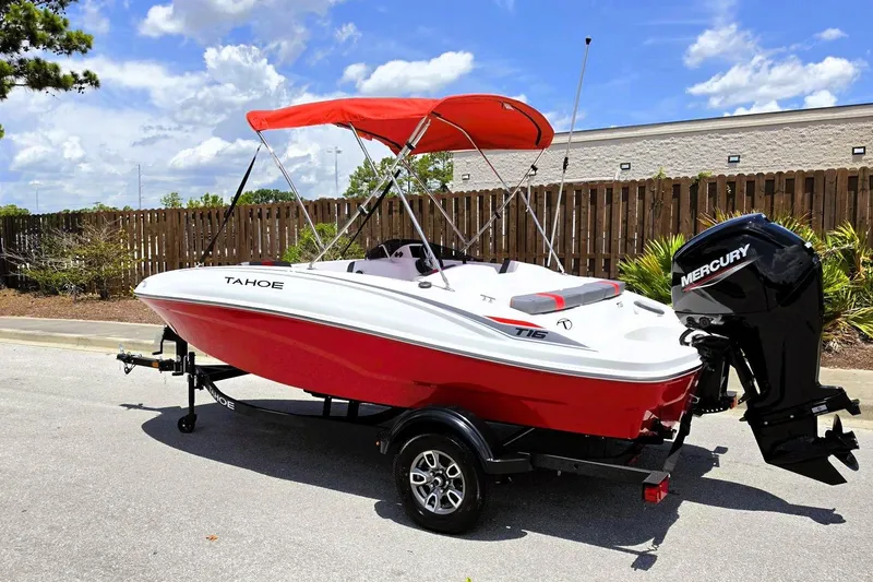 Slide: The Image of 2026 Tahoe T16 boat with red hull and Mercury outboard motor on trailer. - 9