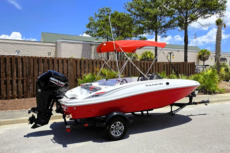 Slide: The Image of 2026 Tahoe T16 boat with red hull and Mercury engine on trailer. - 1