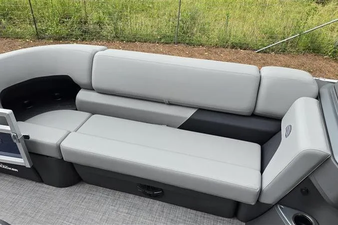 Slide: The Image of 2026 Sun Tracker SportFish 20 DLX pontoon boat with gray seating and spacious layout. - 9