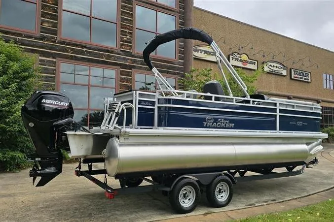 Slide: The Image of 2026 Sun Tracker SportFish 20 DLX pontoon boat with Mercury engine on trailer. - 7