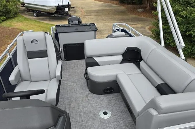Slide: The Image of 2026 Sun Tracker SportFish 20 DLX pontoon boat with gray seating and spacious deck layout. - 13