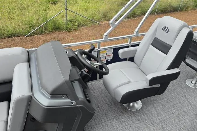 Slide: The Image of 2026 Sun Tracker SportFish 20 DLX boat interior with steering console and comfortable seating. - 10