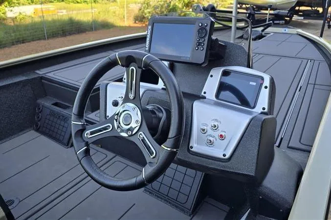 Slide: The Image of Steering console of 2026 Tracker Savage 215 boat with modern navigation equipment. - 8