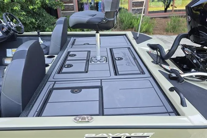 Slide: The Image of 2026 Tracker Savage 215 boat interior with seating and storage compartments. - 9