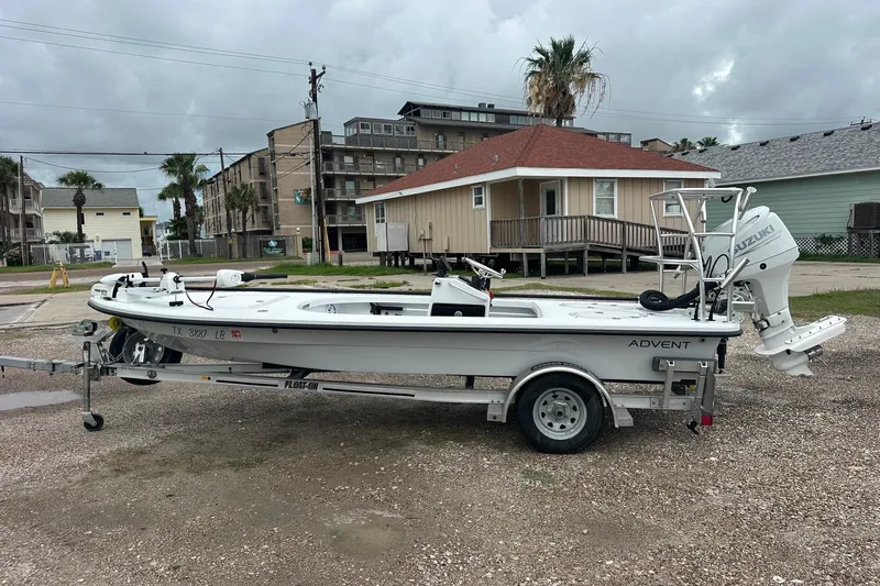 The Image of 2024 Ankona Advent boat on trailer, parked near residential area under cloudy sky. - 0