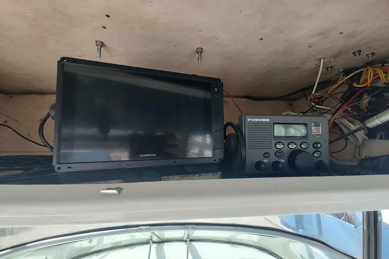 Slide: The Image of Garmin and Furuno marine electronics on 2005 Robalo R265 Walkaround boat dashboard. - 13