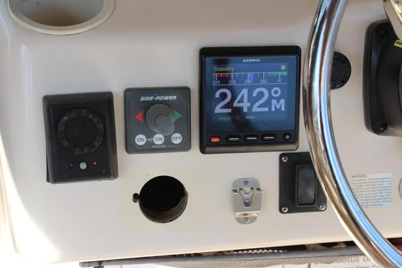 Slide: The Image of Control panel of a 2005 Grady-White Express 330 boat with Garmin display and Side-Power thruster. - 10