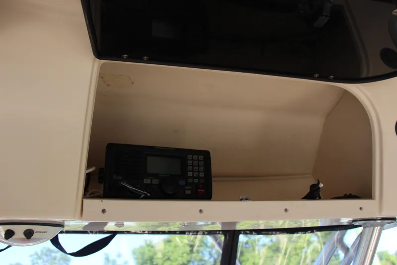 Slide: The Image of Radio equipment in a 2005 Grady-White Express 330 boat compartment. - 20
