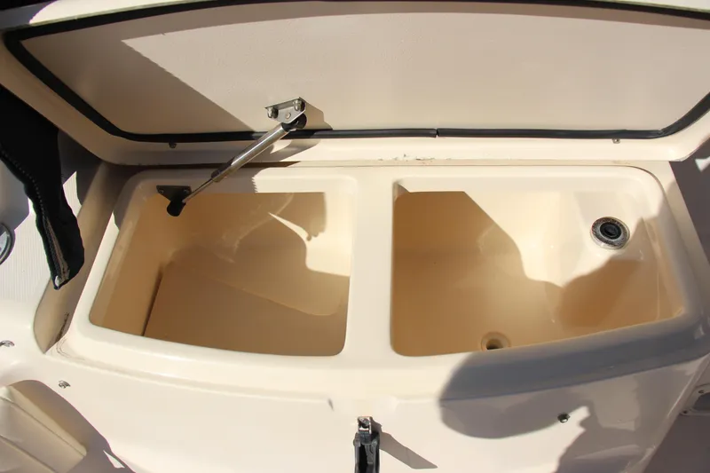 Slide: The Image of 2005 Grady-White Express 330 boat storage compartments, open and empty. - 24