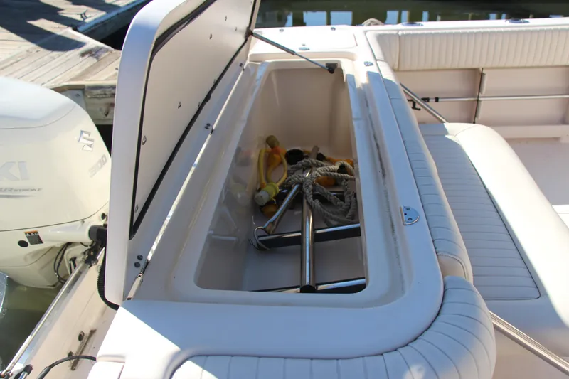 Slide: The Image of Storage compartment on a 2005 Grady-White Express 330 boat, containing ropes and equipment. - 25