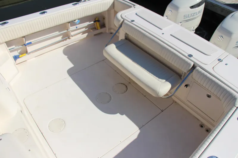 Slide: The Image of 2005 Grady-White Express 330 boat deck with seating and Suzuki engines. - 28