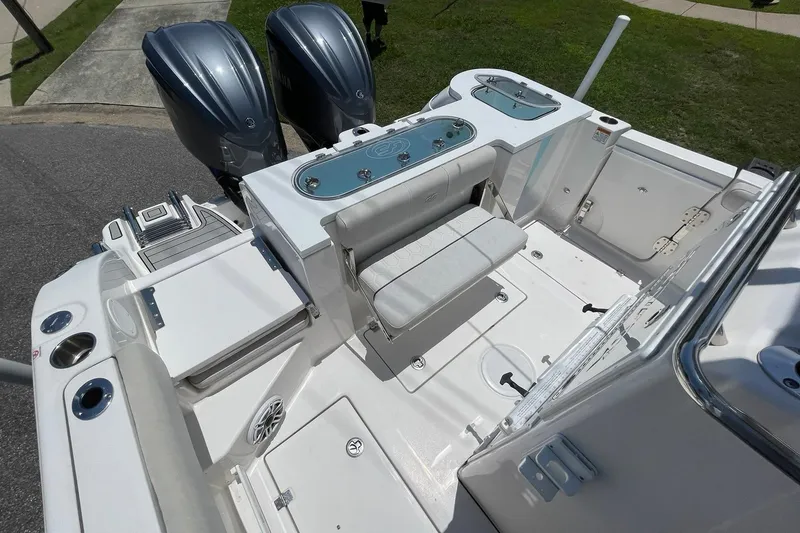 Slide: The Image of 2022 Sea Fox 288 Commander boat deck with dual engines and seating area. - 30