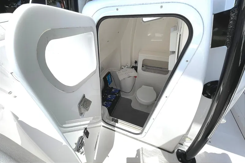 Slide: The Image of HEAD COMPARTMENT IN THE CENTER CONSOLE W/ELECTRIC MARINE TOILET, FRESH WATER SINK, AND TROLLING MOTOR LITHIUM BATTERY BANK - 56