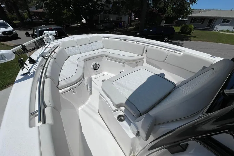 Slide: The Image of BOW OVERVIEW WITH USHAPED LOUNGE SEATING, AND COFFIN BOX STYLE SEAT IN FRONT OF CONSOLE. REMOVABLE CUSHIONS AND TROLLING MOTOR - 7