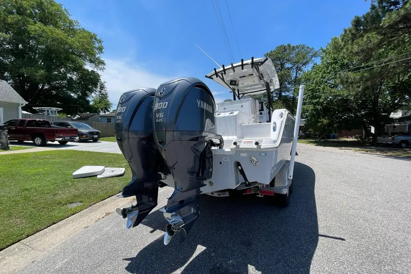 Slide: The Image of 2022 Sea Fox 288 Commander boat with dual Yamaha V6 engines on a sunny street. - 70