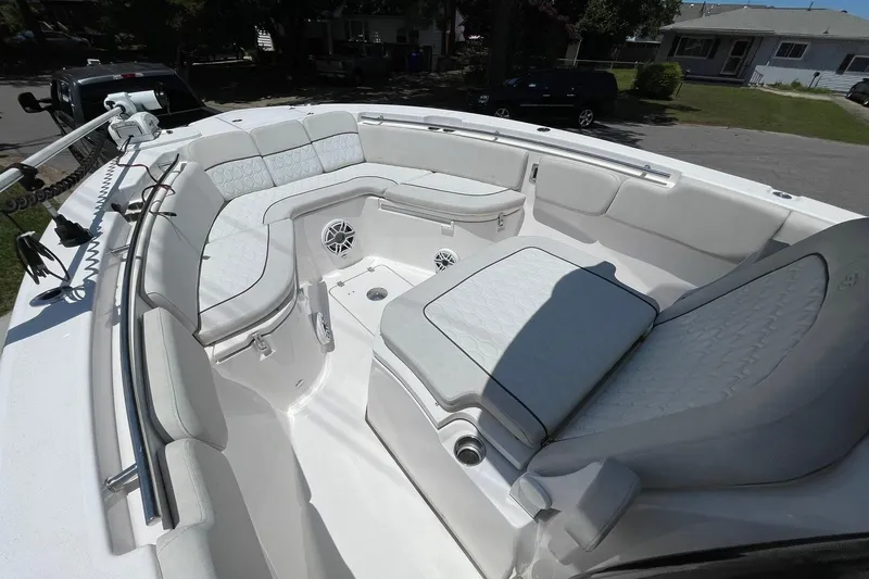 Slide: The Image of 2022 Sea Fox 288 Commander boat interior with cushioned seating and stainless steel railings, along with a trolling motor - 8