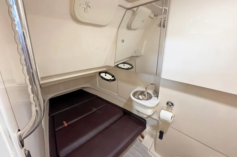 Slide: The Image of Interior of 2021 Scout 305 LXF with toilet and sink. - 10