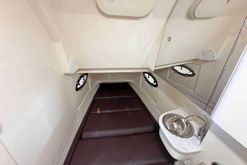 Slide: The Image of 2021 Scout 305 LXF cabin interior with sink and seating area. - 11