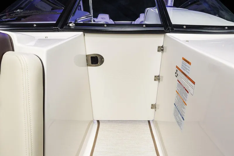 Slide: The Image of Manufacturer Provided Image: 2021 Chaparral 347 SSX boat interior with white door and seating. - 16