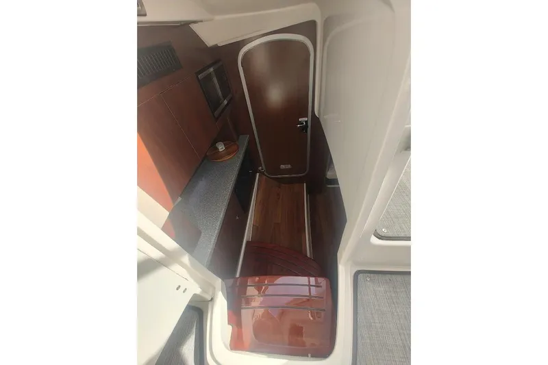 Slide: The Image of Interior view of 2021 Chaparral 347 SSX boat, featuring sleek cabinetry and modern design. - 22