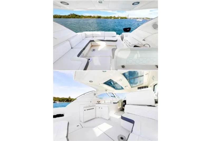 Slide: The Image of 2009 Sea Ray 43 Sundancer yacht interior with white seating and scenic water views. - 4