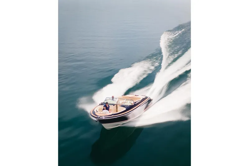 Slide: The Image of 2022 Chris Craft 34 Launch Heritage speeding on open water. - 13