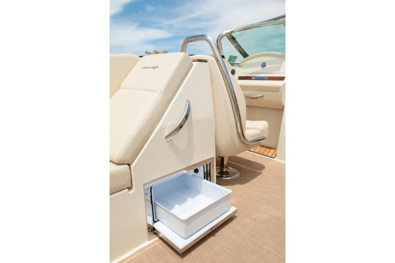 Slide: The Image of 2022 Chris Craft 34 Launch Heritage boat interior with open storage compartment. - 22