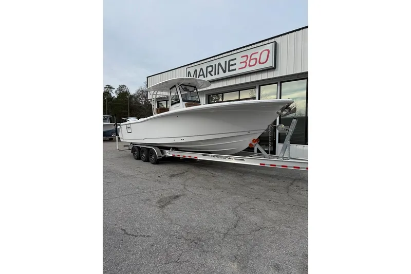 Slide: The Image of 2026 Sea Hunt Ultra 305 Coffin Box boat on trailer at Marine 360 dealership. - 1