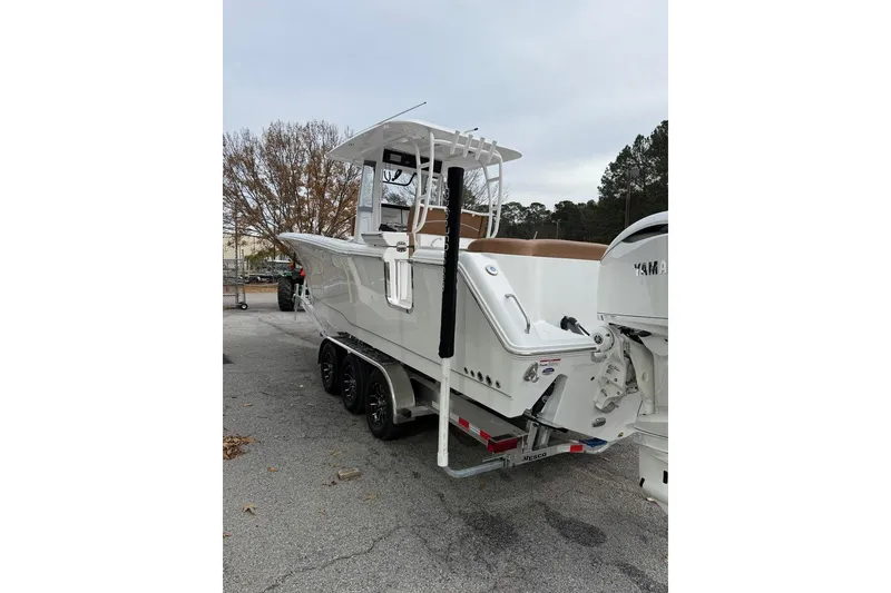 Slide: The Image of 2026 Sea Hunt Ultra 305 Coffin Box boat with twin Yamaha engines at Marine 360. - 2