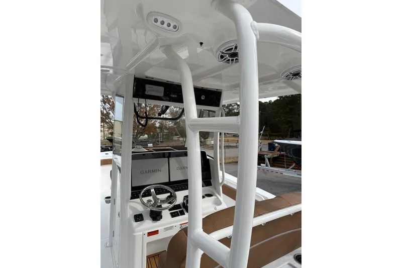 Slide: The Image of Helm of 2026 Sea Hunt Ultra 305 Coffin Box with Garmin displays and steering wheel. - 7