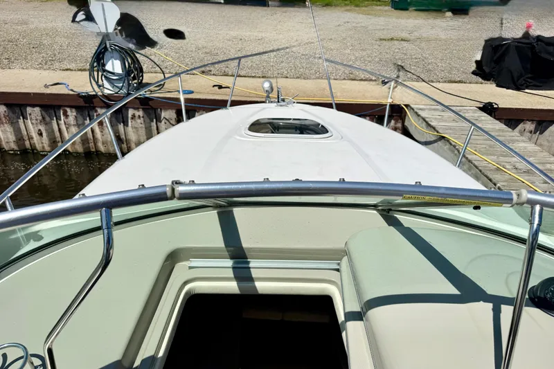 Slide: The Image of 2005 Sea Ray Sundancer 260 boat docked, view from cockpit to bow. - 14
