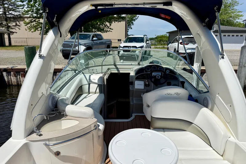Slide: The Image of 2005 Sea Ray Sundancer 260 boat interior with seating, steering wheel, and dashboard. - 15