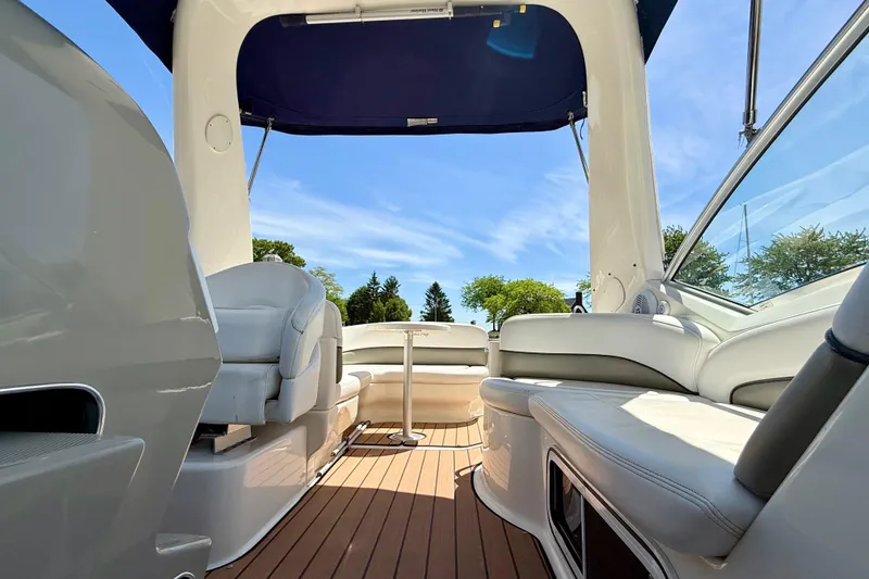 Slide: The Image of Interior view of 2005 Sea Ray Sundancer 260 boat with seating and canopy. - 16
