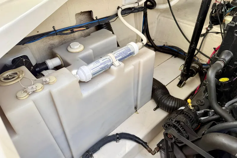 Slide: The Image of Engine compartment of a 2005 Sea Ray Sundancer 260, showcasing fuel and water systems. - 29