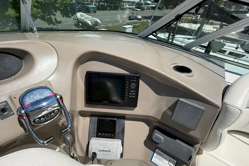 Slide: The Image of 1999 Carver 450 Voyager Pilothouse helm with Garmin navigation system and controls. - 14