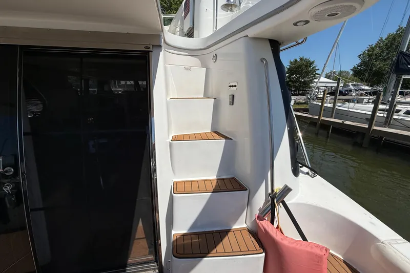 Slide: The Image of Staircase on 1999 Carver 450 Voyager Pilothouse yacht, docked by the marina. - 15