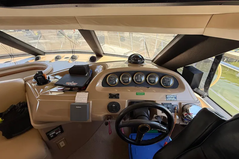 Slide: The Image of 1999 Carver 450 Voyager Pilothouse helm with gauges and steering wheel. - 30